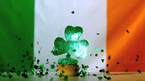 Shamrock-confetti-falling-on-st-patricks-day-cupcake-