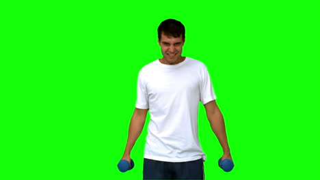 Attractive-man-lifting-dumbbells-on-green-screen