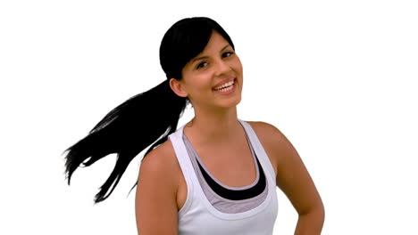 Fit-woman-tossing-her-hair-and-smiling