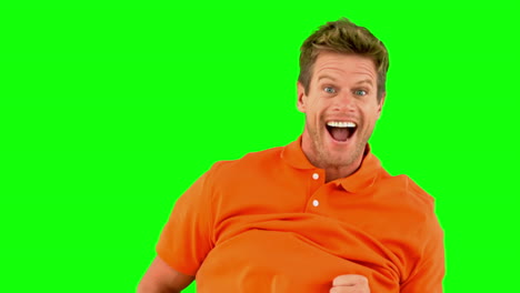 Handsome-man-jumping-on-green-screen