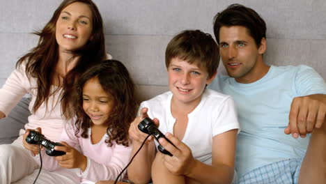 Family-playing-at-video-game