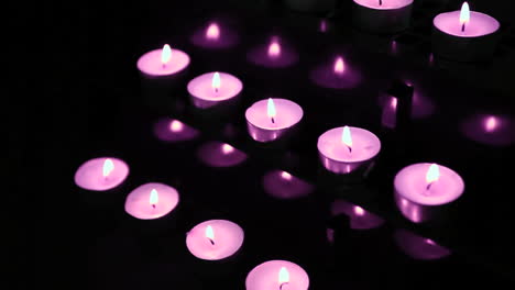 Pink-candles-at-alter-blowing-out