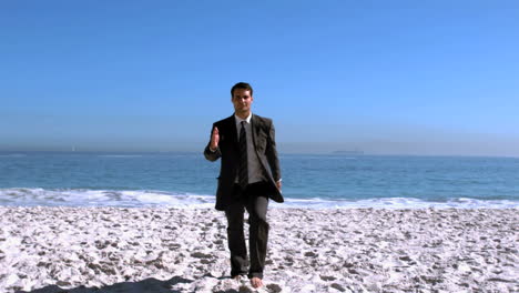 Businessman-walking-on-the-beach-like-a-robot