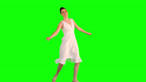 Cheerful-model-in-white-dress-dancing