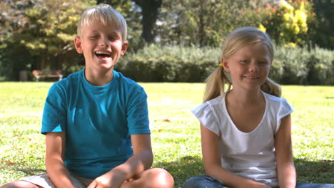 Brother-throwing-a-paper-airplane-next-to-his-sister