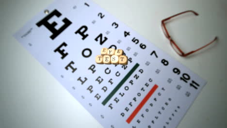 Dice-spelling-out-eye-test-falling-onto-eye-test