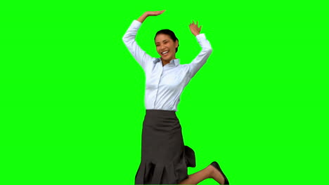 Happy-businesswoman-raising-arms-on-green-screen