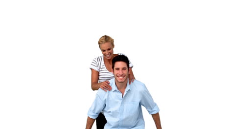 Smiling-man-giving-to-his-girlfriend-a-piggyback
