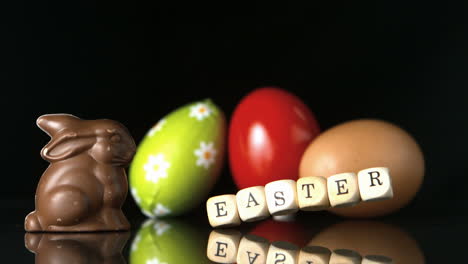 Dice-spelling-out-easter-falling-in-front-of-easter-treats-and-egg