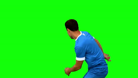 Handsome-football-player-warming-up-on-green-screen