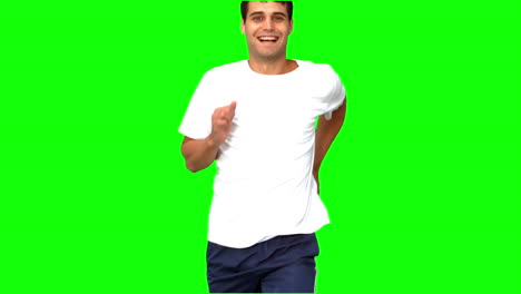 Cheerful-man-jogging-on-green-screen