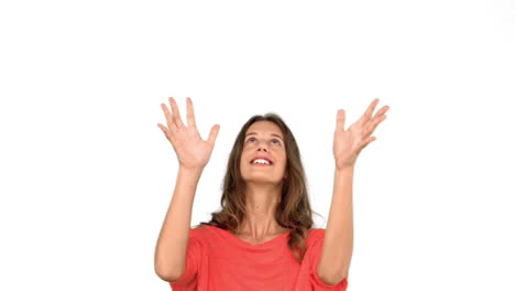 Woman-throwing-a-globe-in-the-air-on-white-background