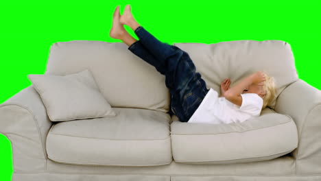 Boy-jumping-on-the-sofa-on-green-screen