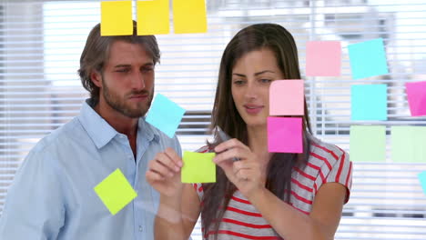 Creative-team-pointing-adhesive-notes