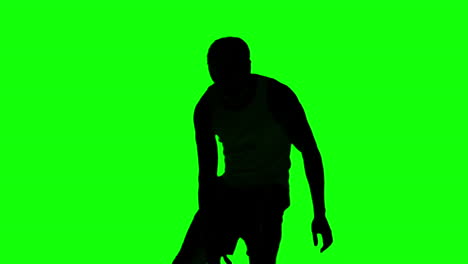Silhouette-of-a-man-playing-basket-on-green-screen