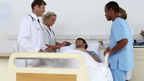 Medical-team-standing-around-patient