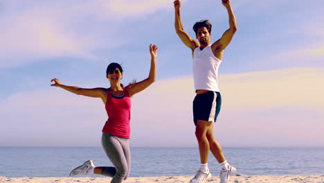 Couple-jumping-with-hands-up