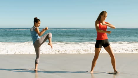 Women-doing-martial-arts-on-the-beach