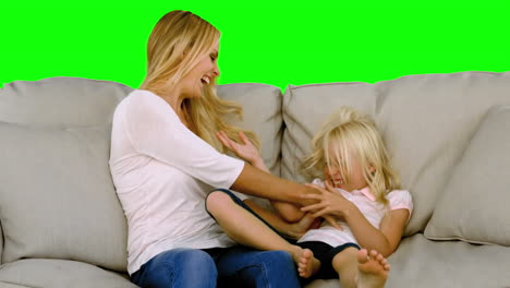 Mother-tickling-her-daughter-in-slow-motion