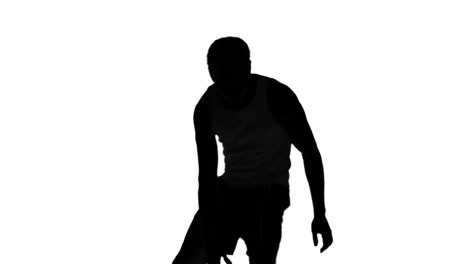 Silhouette-of-a-man-playing-basket-on-white-background