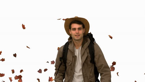 Man-walking-under-leaves-falling-on-white-screen