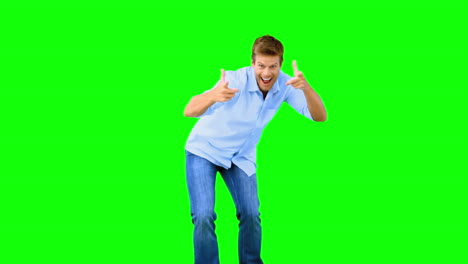 Man-skating-and-pointing-at-camera-on-green-screen