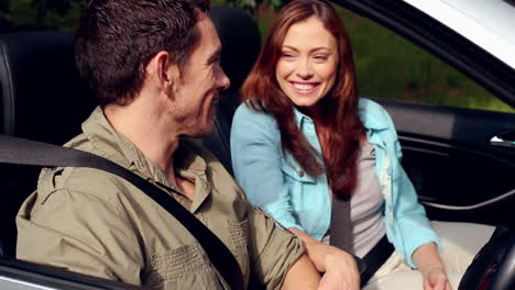 Attractive-couple-in-a-convertible-car