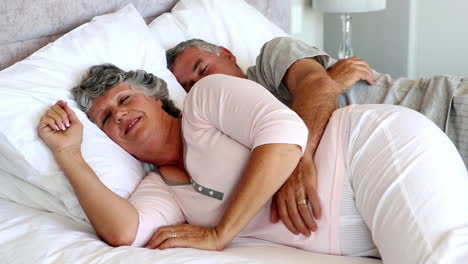 Mature-couple-sleeping-together