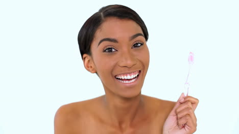 Woman-dancing-while-holding-a-toothbrush