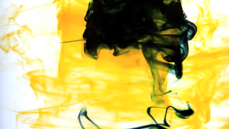 Yellow-ink-swirling-into-water-whirlpool