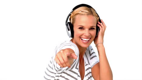 Smiling-woman-pointing-at-the-camera-on-white-background