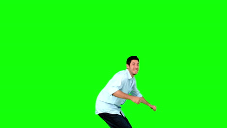 Young-man-jumping-on-green-screen