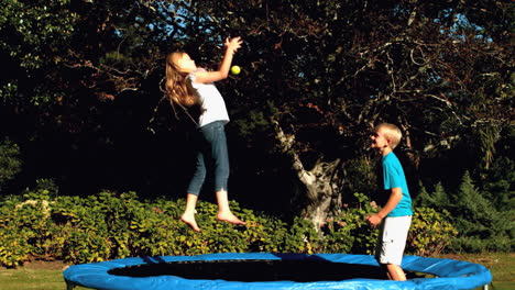Siblings-playing-together-on-a-trampoline