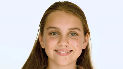 Girl-smiling-against-white-background