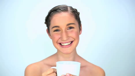 Young-woman-smelling-her-cup