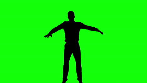 Silhouette-Eines-Mannes,-Der-Mit-Erhobenen-Beinen-Auf-Einem-Grünen-Bildschirm-Springt