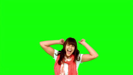 Brunette-woman-jumping-on-green-screen