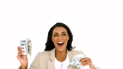 Cheerful-businesswoman-holding-dollars-and-jumping