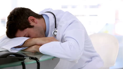 Sleeping-doctor-woken-by-his-coworker
