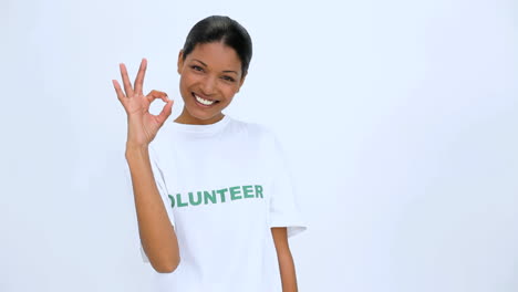 Volunteer-woman-does-sign-at-camera