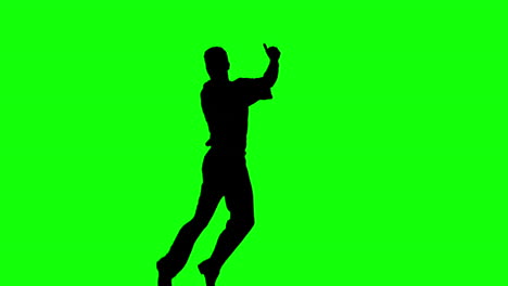 Silhouette-of-man-jumping-and-giving-thumb-up-on-green-screen