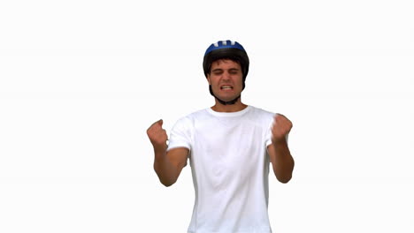 Man-wearing-a-helmet-holding-his-head-white-screen