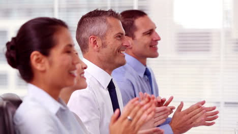 Cheerful-business-people-applauding