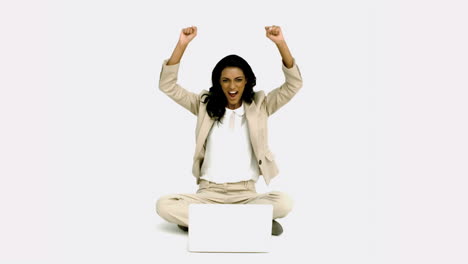 Woman-cheering-in-front-of-laptop