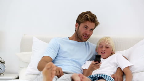 Father-and-son-watching-television-together