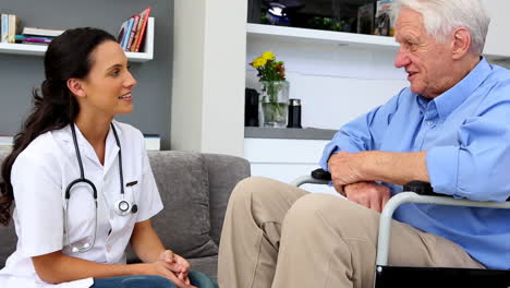 Patient-in-wheelchair-thanking-his-nurse