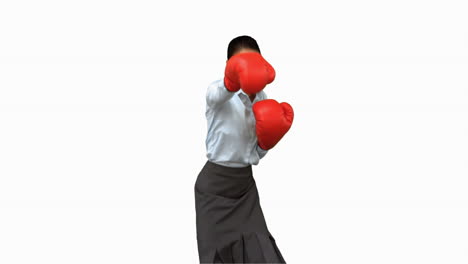 Businesswoman-with-boxing-gloves-hitting-on-white-screen
