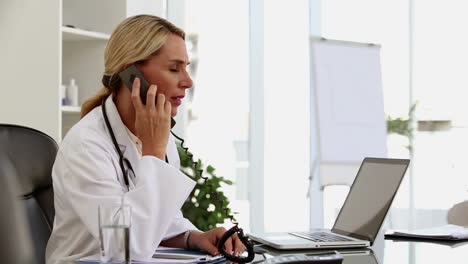 Busy-doctor-working-at-her-desk