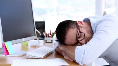 Creative-designer-napping-on-his-desk