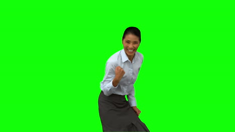Cheerful-businesswoman-gesturing-on-green-screen